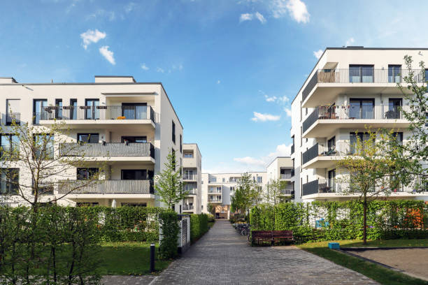 Cityscape of a residential area with modern apartment buildings, new green urban landscape in the city Cityscape of a residential area with modern apartment buildings, new green urban landscape in the city real estate stock pictures, royalty-free photos & images